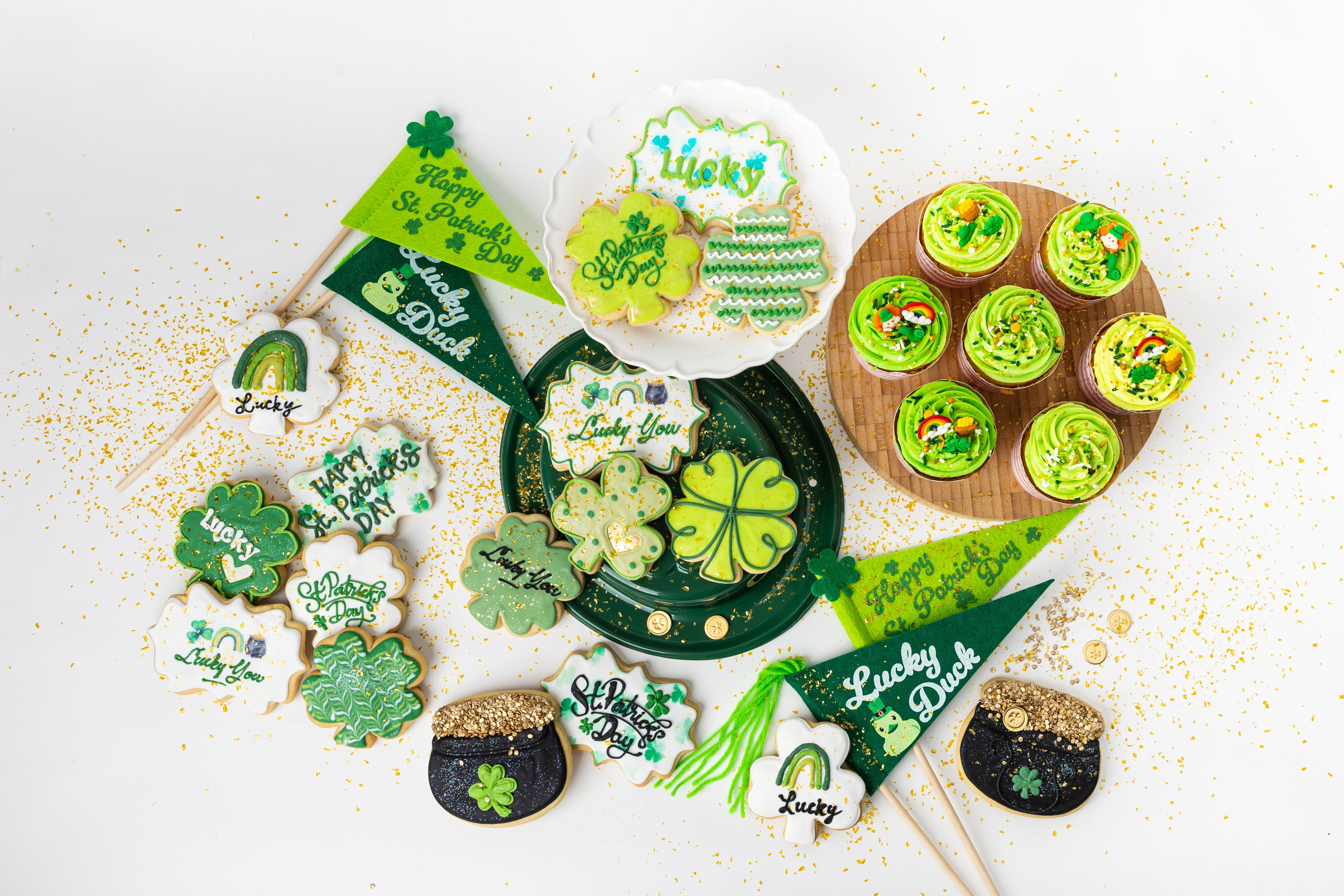 St. Patrick's Day themed cookies and cupcakes with green decor