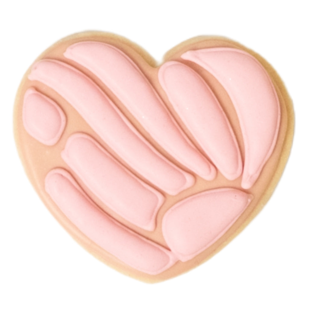 Cinco de Mayo heart-shaped cookie with pink icing stripes