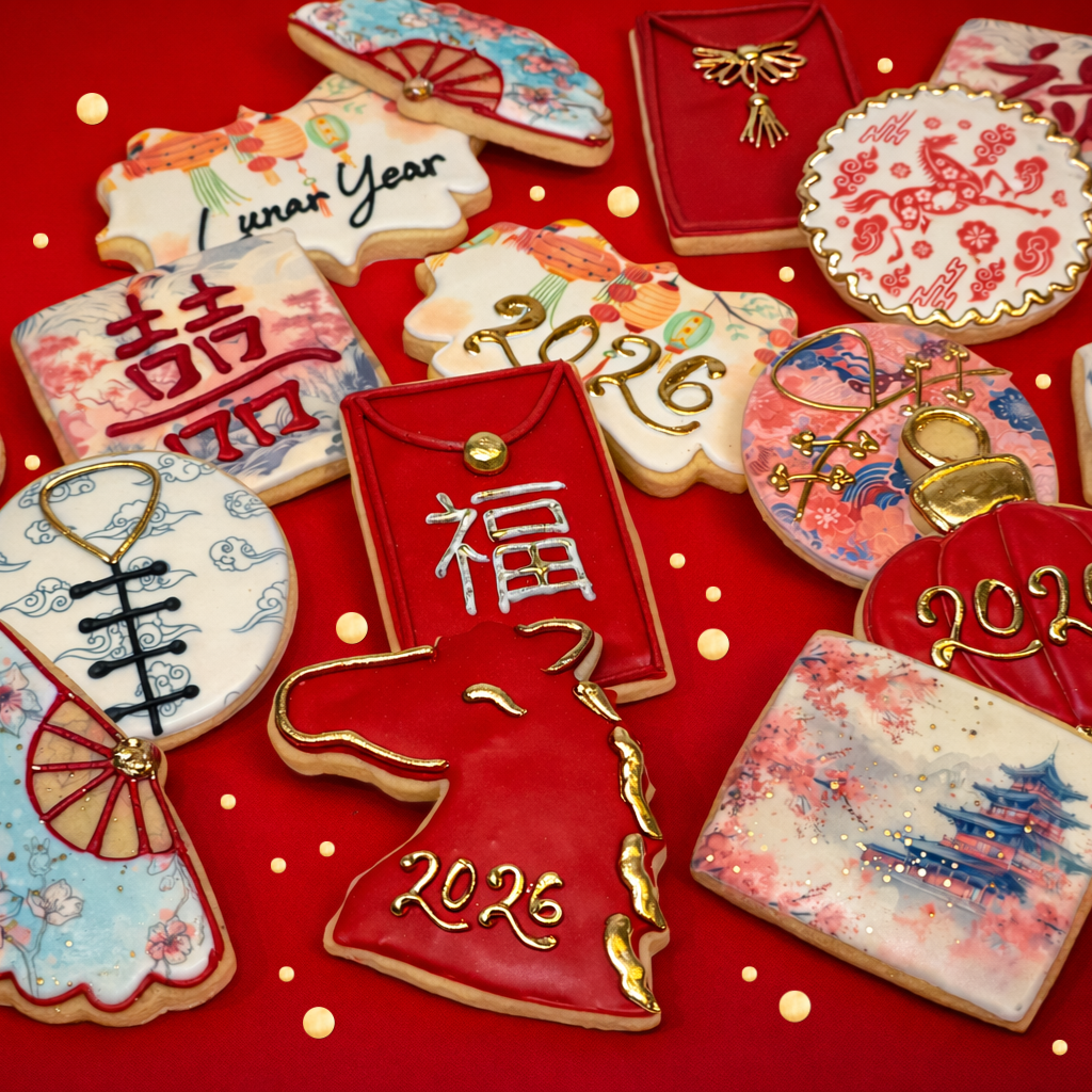 Assorted Lunar New Year cookies with festive red and gold icing.