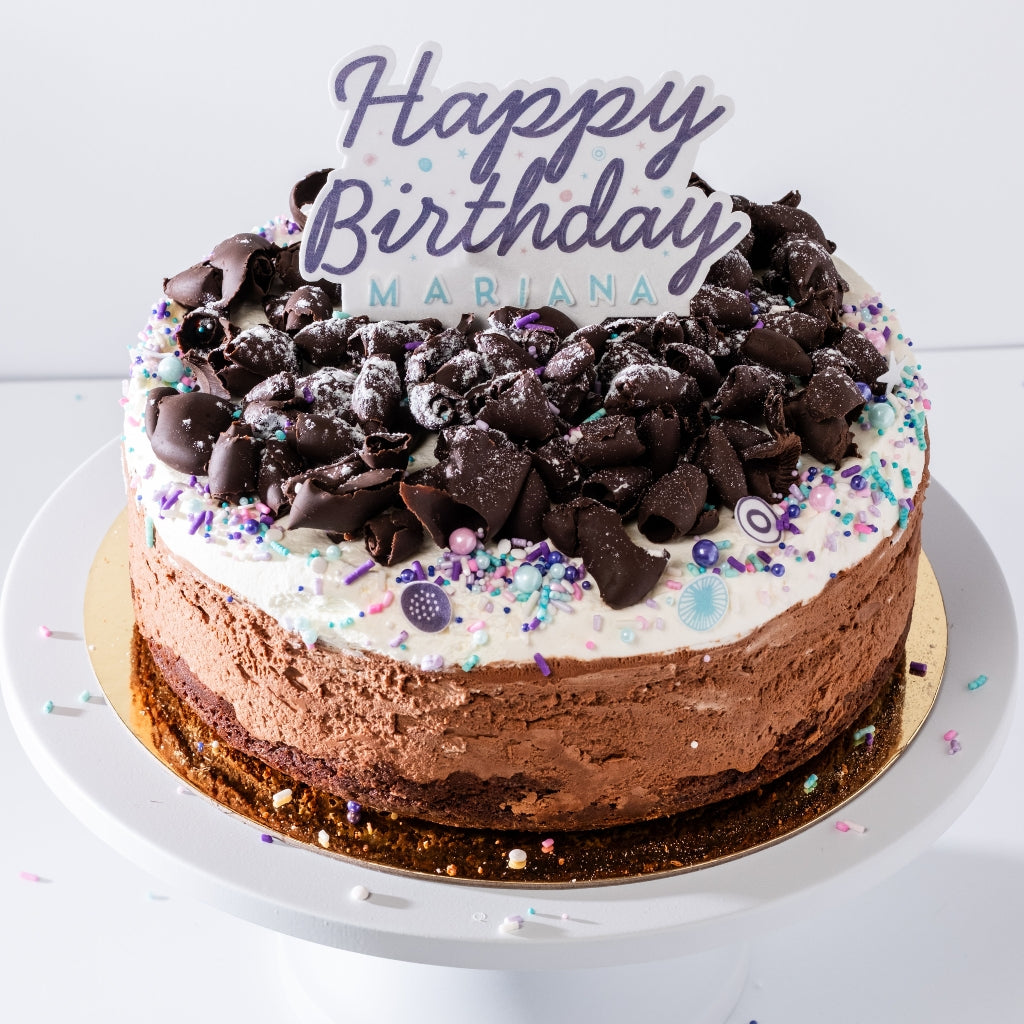 9-inch GF mousse cake topped with chocolate curls and sprinkles