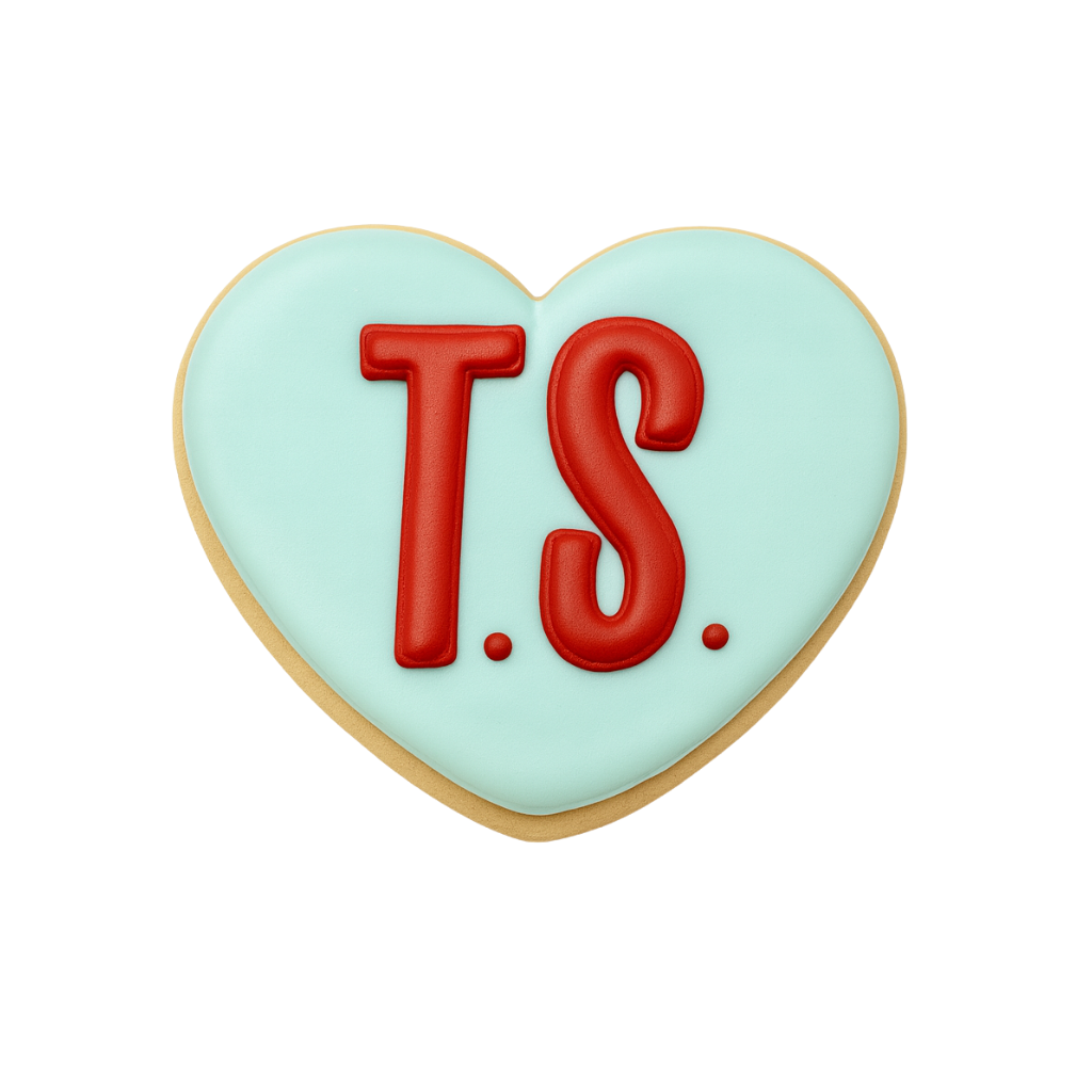 Life of a Dough Girl heart cookie with red T.S. lettering.