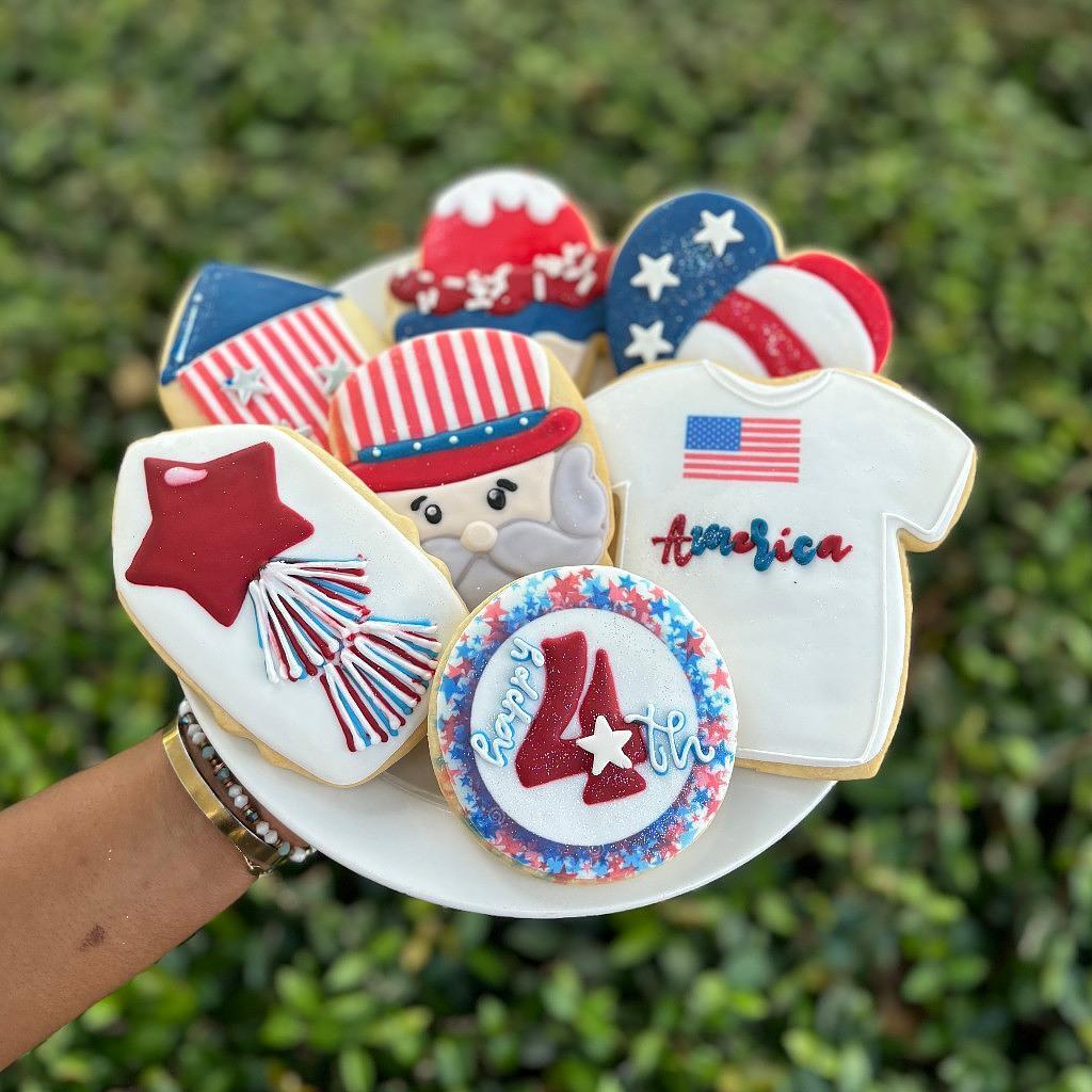 Assorted 4th of July cookies with patriotic icing designs.
