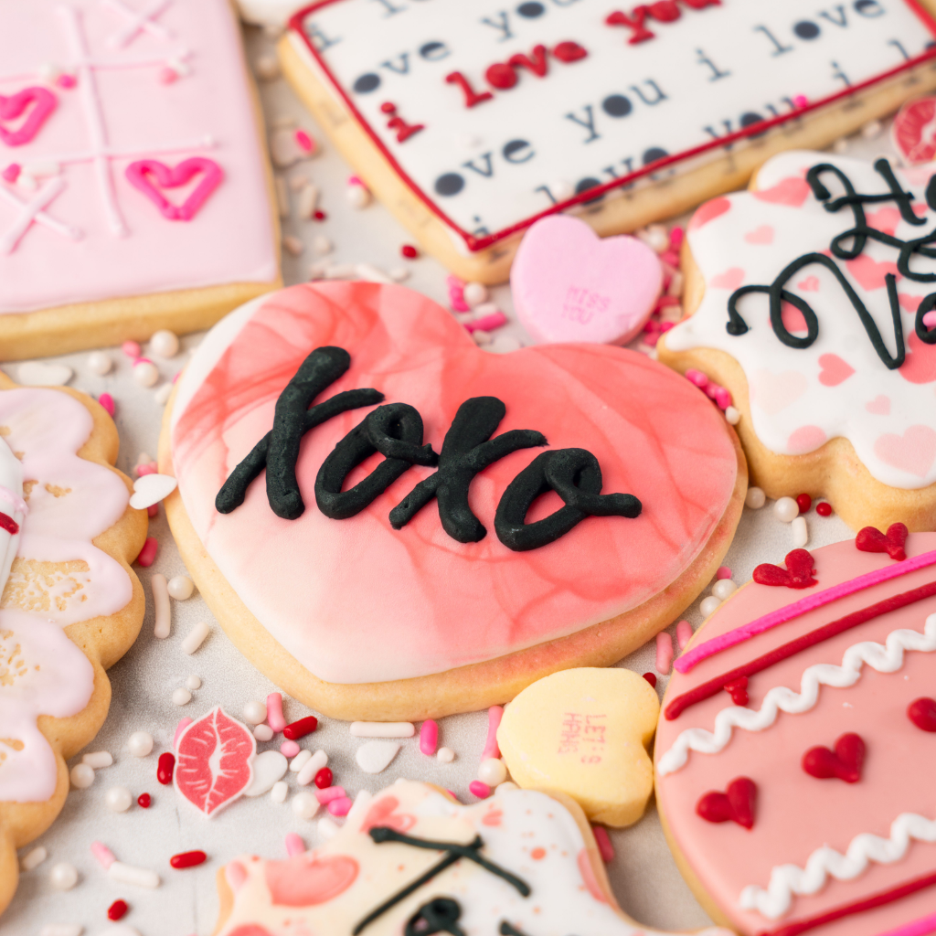 Assorted Valentine butter cookies decorated with pink icing.