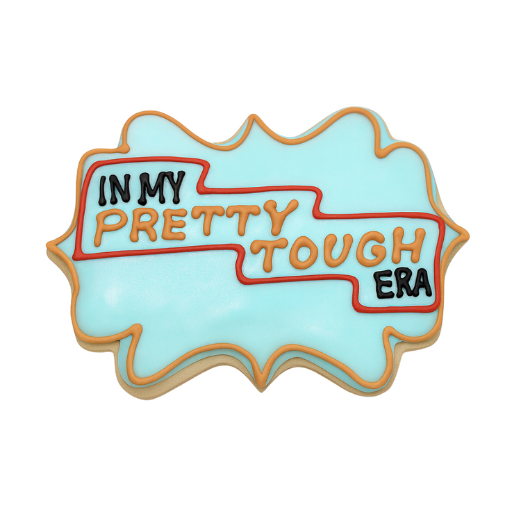 Life of a Dough Girl cookie with blue icing and text.