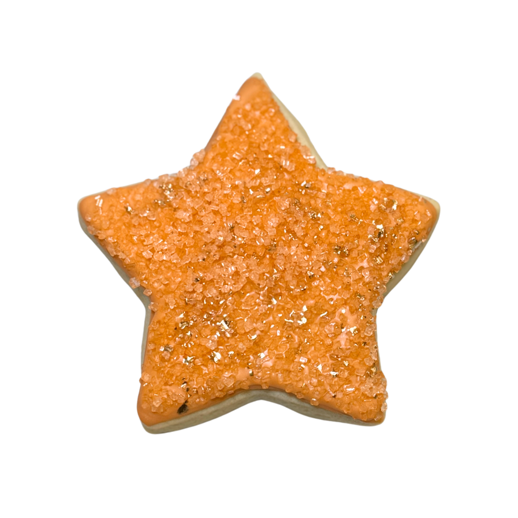 Life of a Dough Girl star-shaped cookie with orange sugar.