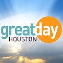 Great Day Houston logo against a bright, cloudy sky background.