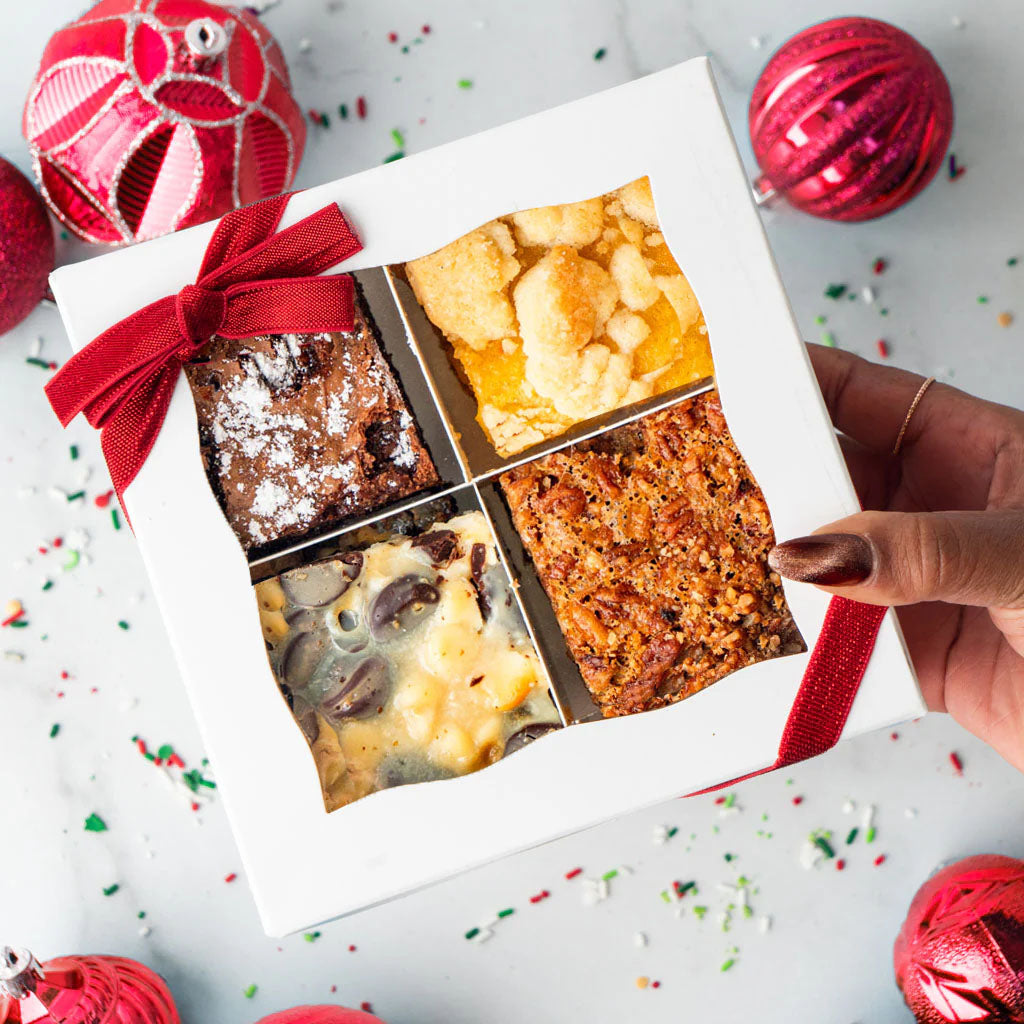 Bar cookie gift box with four assorted flavors and red ribbon.