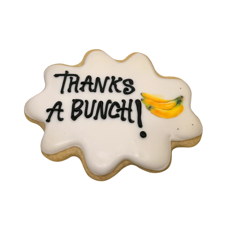 Boss's Week cookie with white icing and banana illustration.