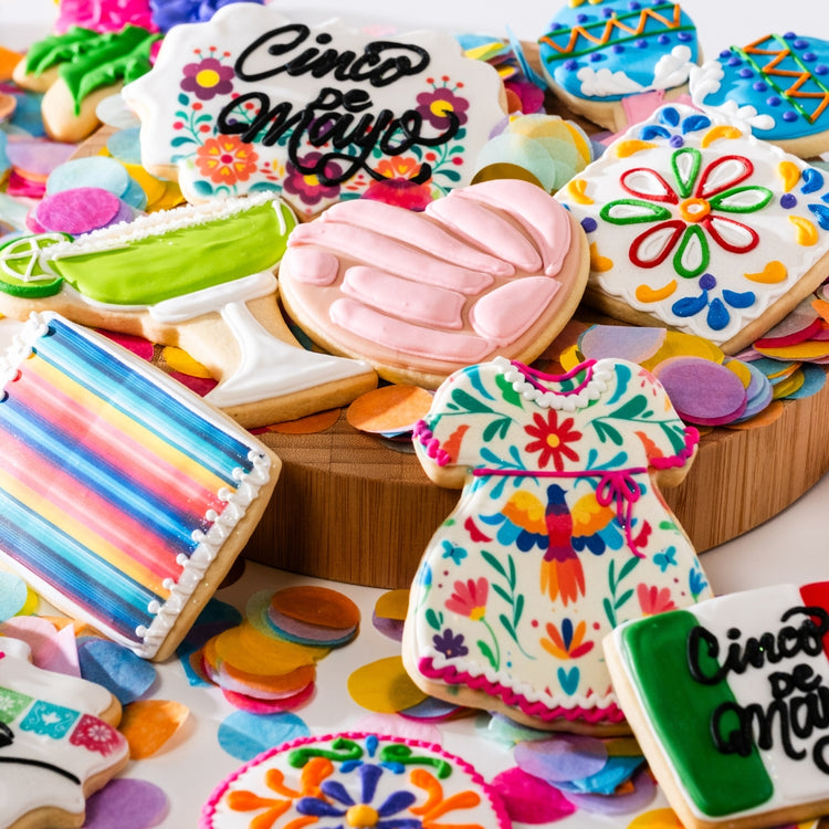 Assorted Cinco de Mayo cookies with colorful festive icing.