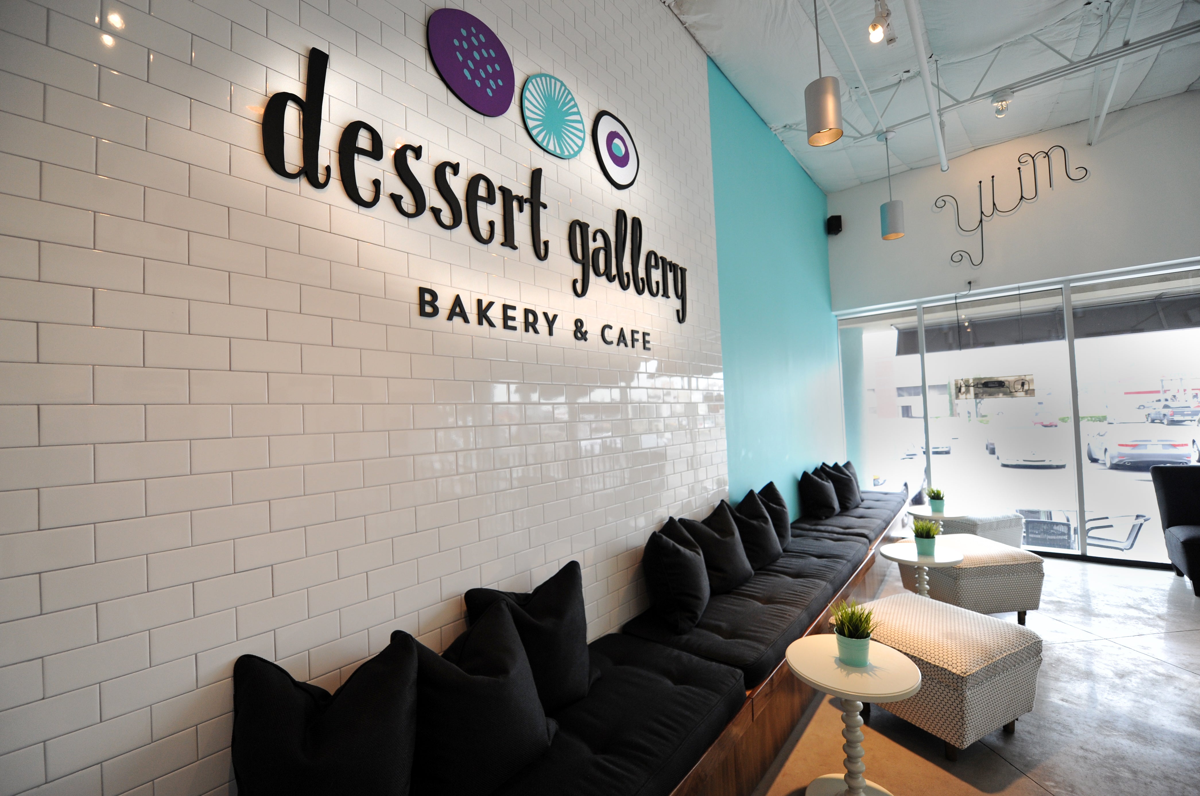 Dessert Gallery Bakery & Cafe interior with black bench seating