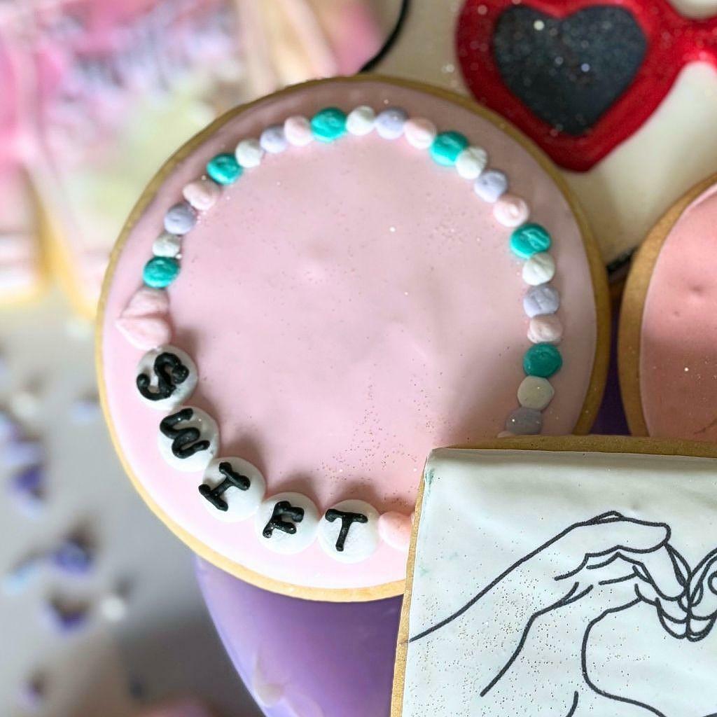 Taylor Swift friendship bracelet cookie with pink icing