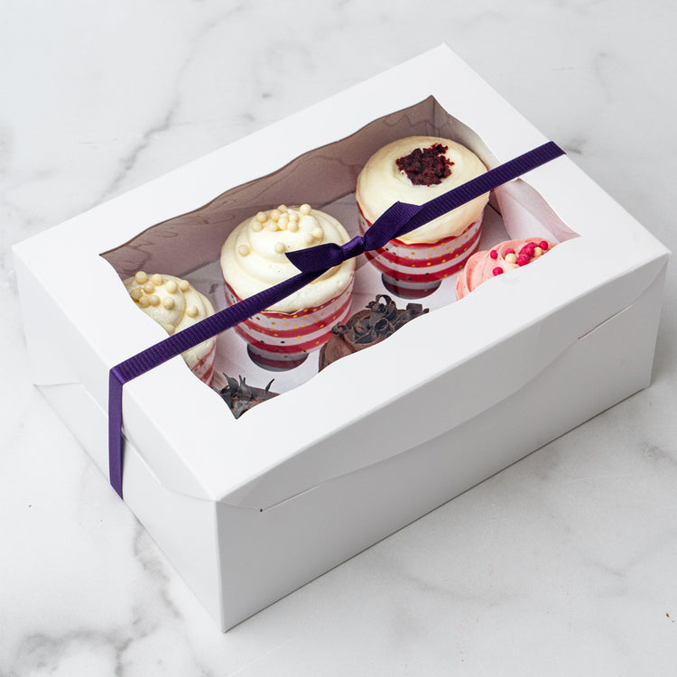6-pack cupcake gift box with a purple ribbon and window lid.