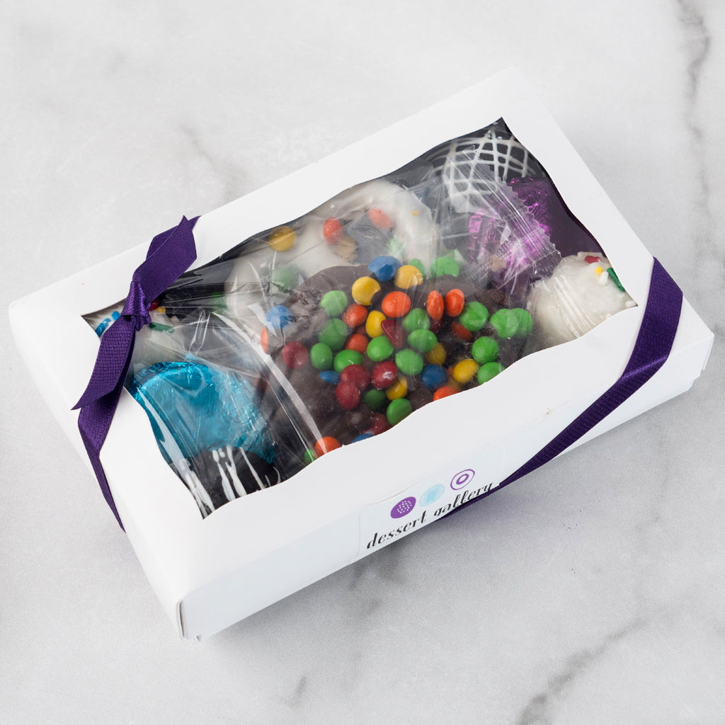 Chocolate Dipped Delights in a white gift box with purple ribbon