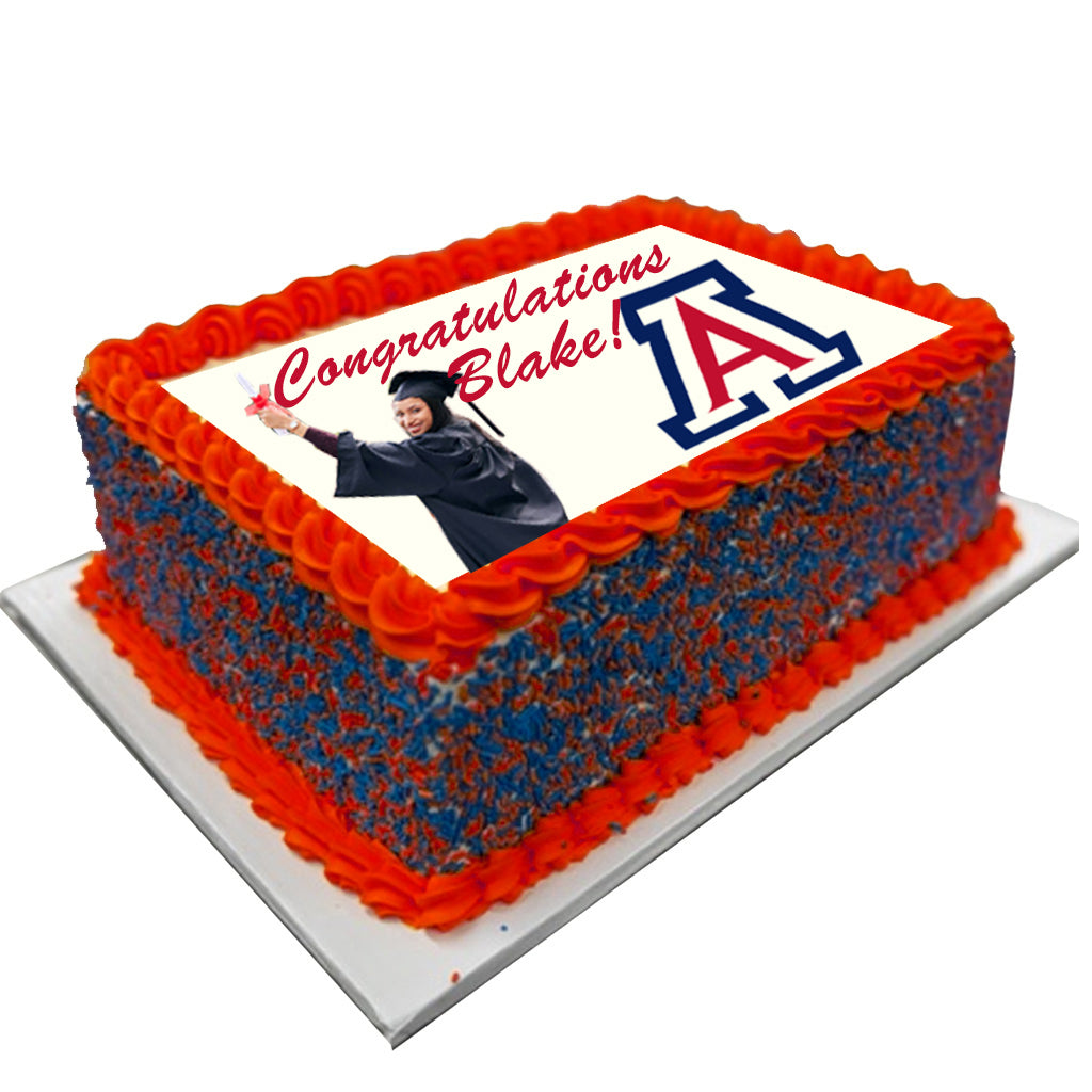 Graduation photo and logo sheet cake with orange frosting.