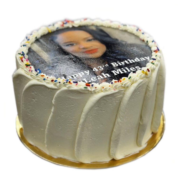 9-inch photo cake with white frosting and rainbow sprinkles