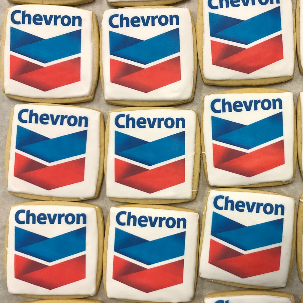 Square cookies with Chevron logo icing arranged in rows.