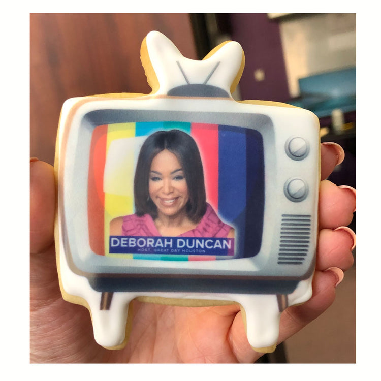 Custom television-shaped cookie with a printed photo logo.