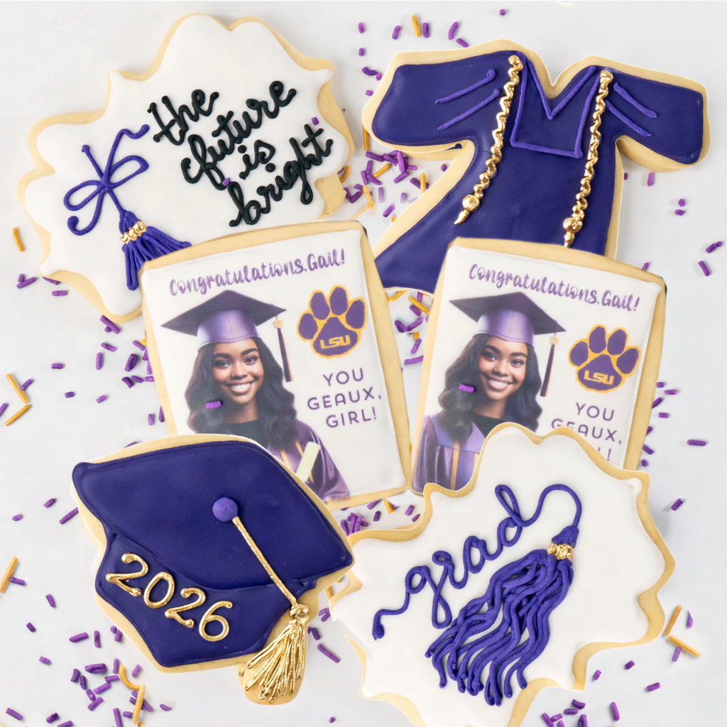 Graduation cookie gift box with purple and gold LSU designs.