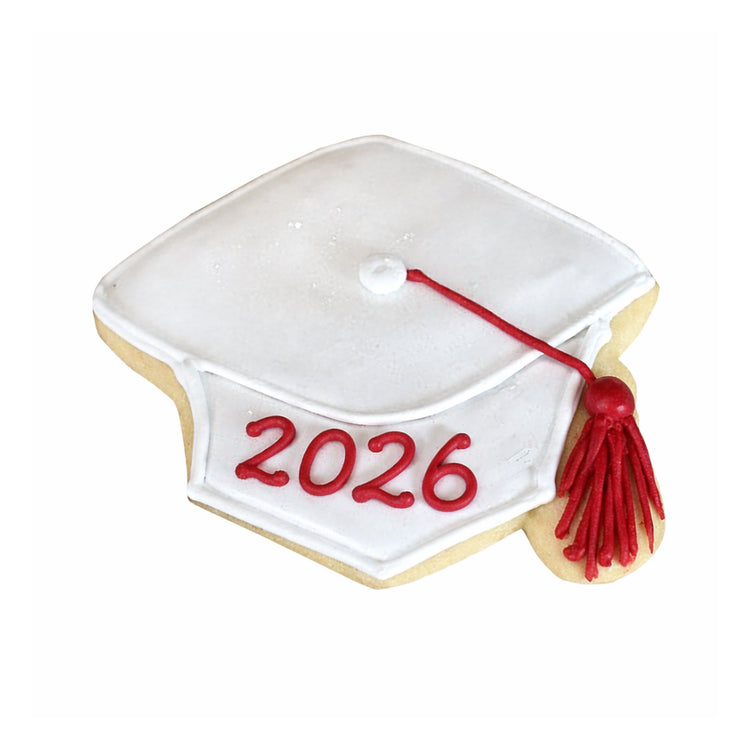Graduation cap cookie with white icing and red 2026 tassel.