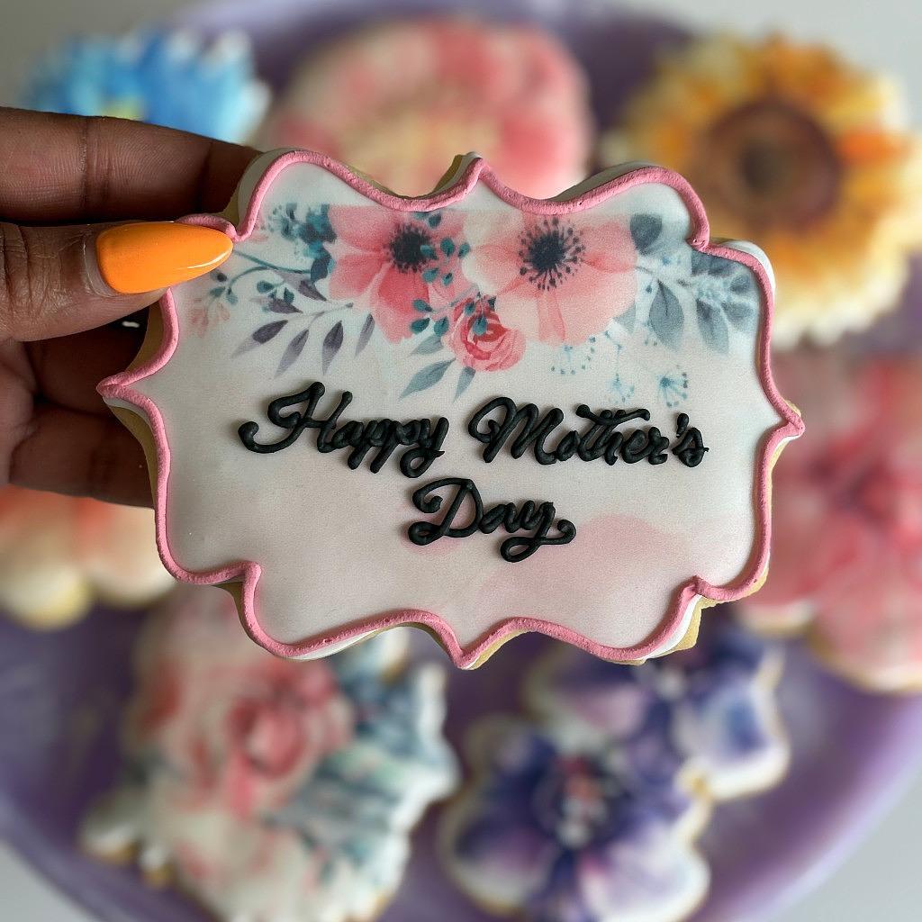 Mother's Day cookies with floral icing and pink trim