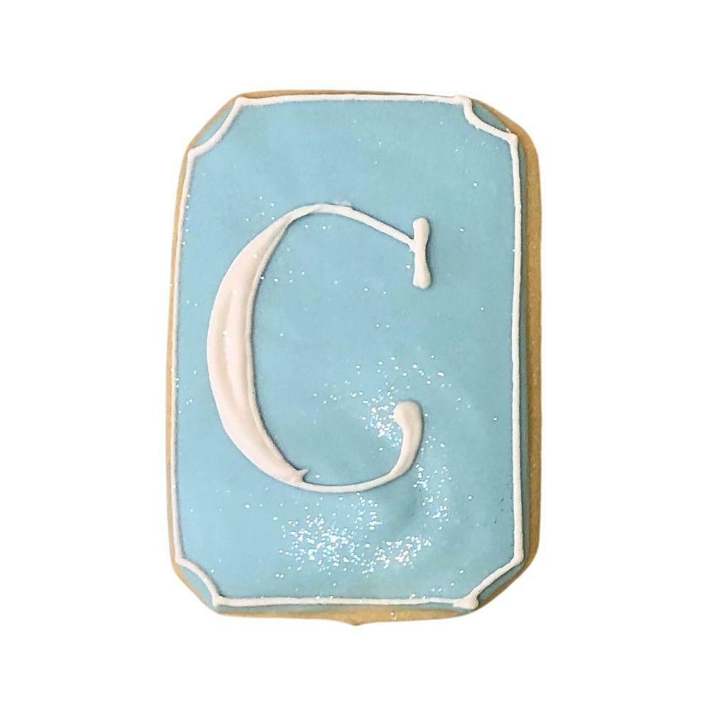 Name and Initial plaque cookie with letter C in light blue.