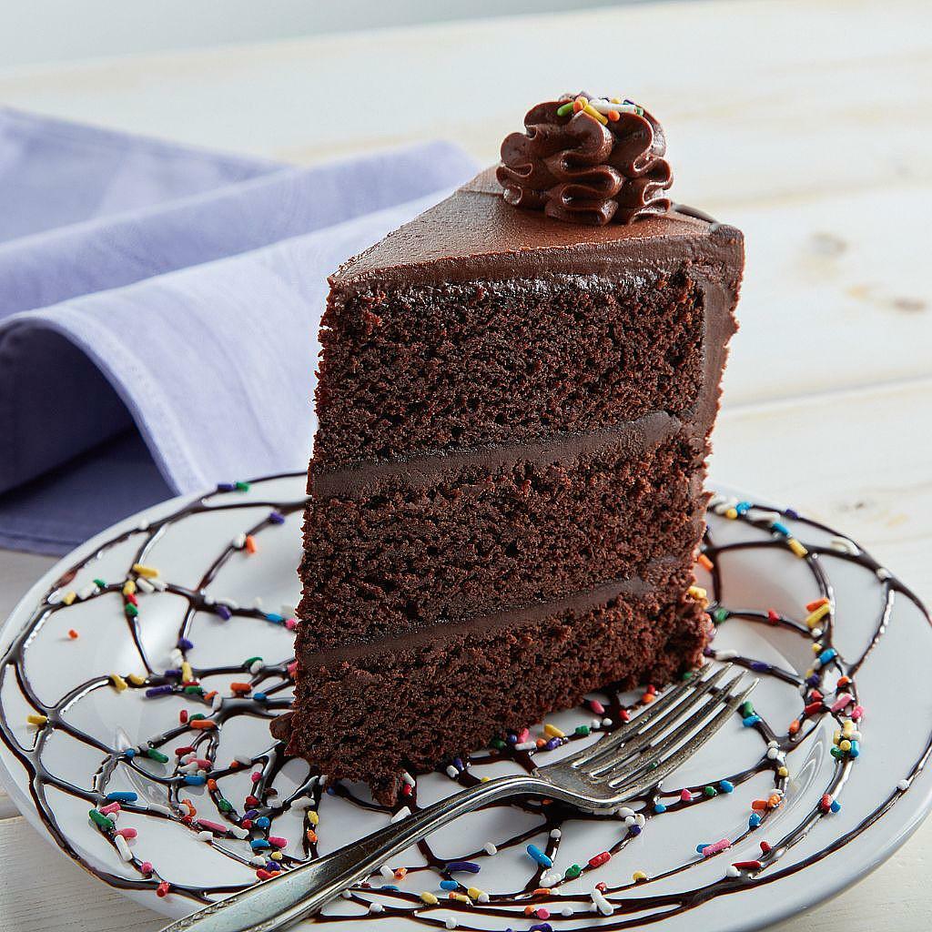 Jennifer's 9-inch chocolate layer cake slice with sprinkles