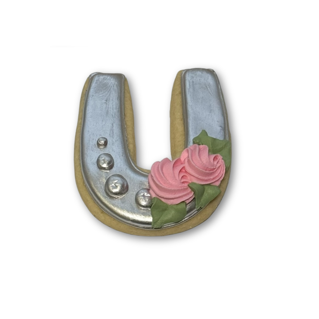 Kentucky Derby horseshoe cookie with silver icing and pink roses