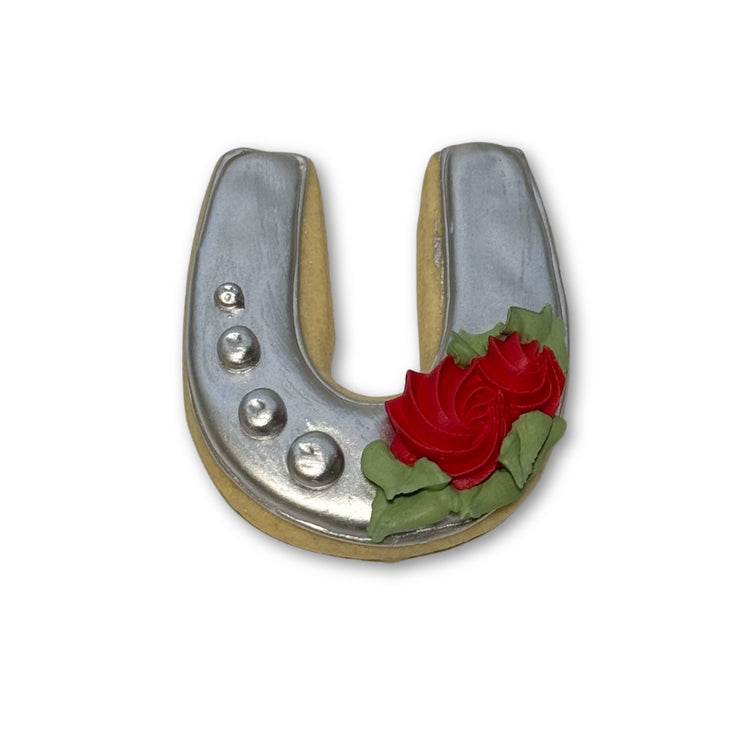 Kentucky Derby horseshoe cookie with silver icing and red roses