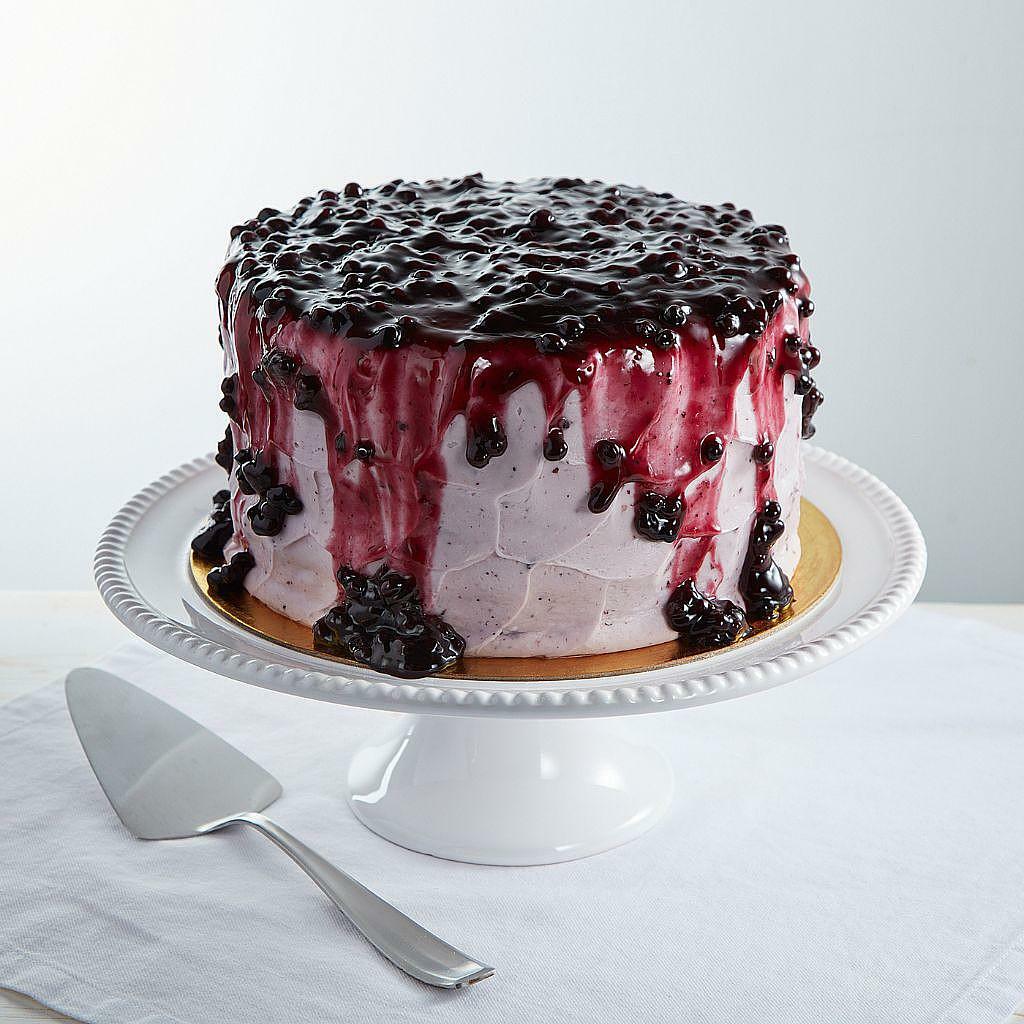 9-inch lemon blueberry cake with a blueberry drip glaze.