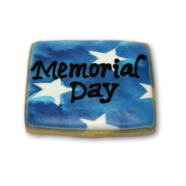 Memorial Day cookie with blue watercolor stars and black text.
