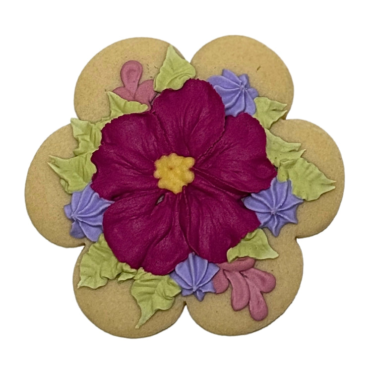 Mother's Day flower-shaped cookie with purple frosting.