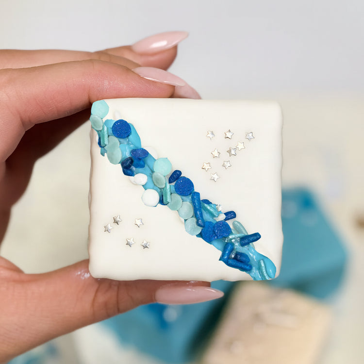 Hanukkah petit four with blue sprinkles and silver stars