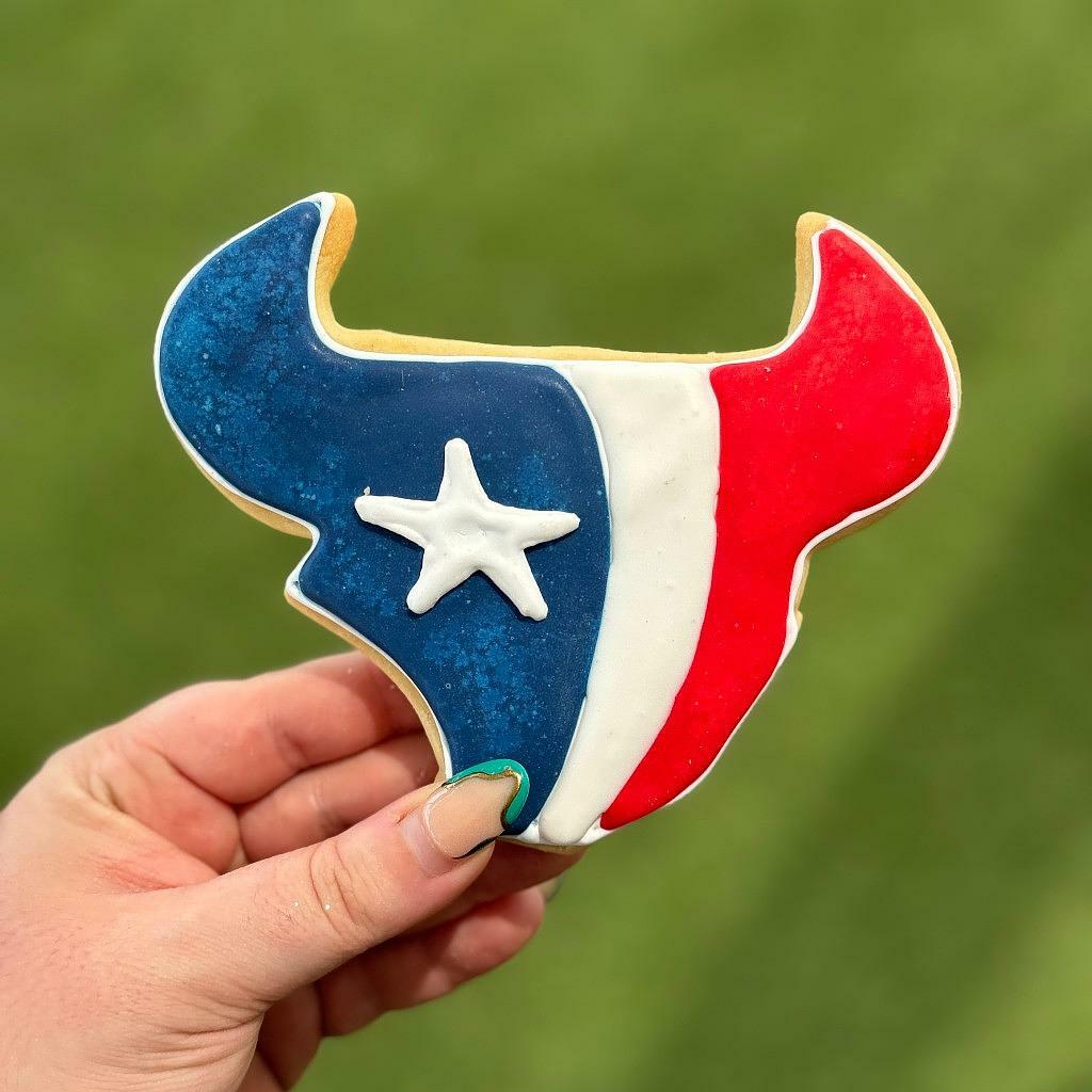 Texans logo cookie with red, white, and blue icing.