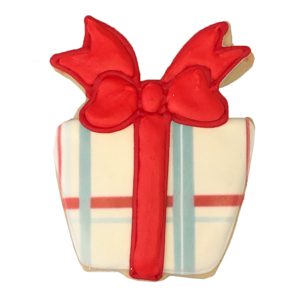 Birthday present cookie with a red bow and plaid pattern.