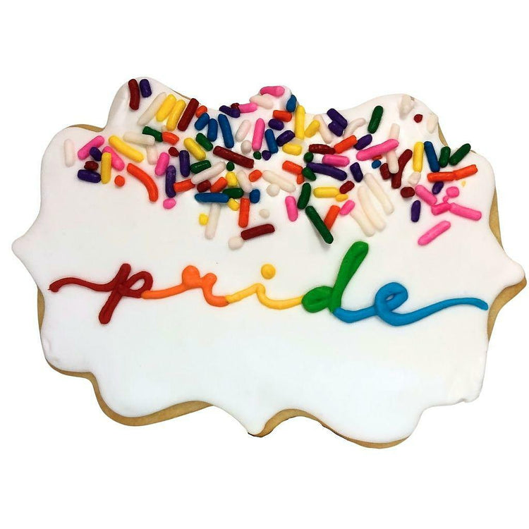 Rainbow message cookie with white icing and colorful sprinkles.