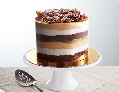 6-inch Pumpkin Dream Cake with layered frosting on a white stand.
