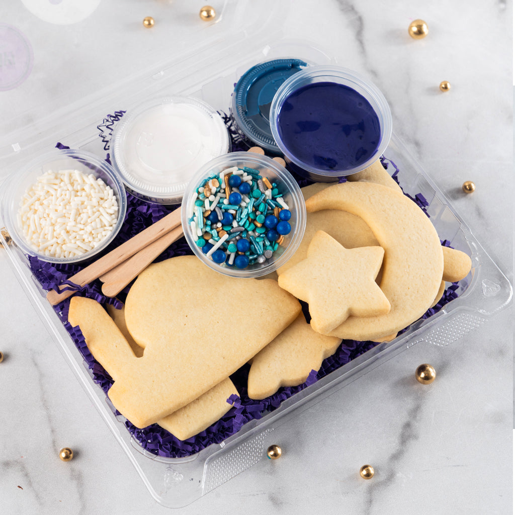 Ramadan Cookie Decorating Kit with blue and white icing and sprinkles.
