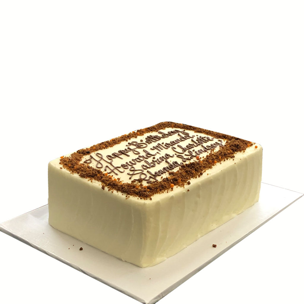 Carrot sheet cake with white frosting and birthday message