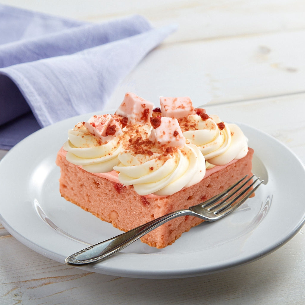 Strawberry Crunch slab topped with frosting and fruit pieces.