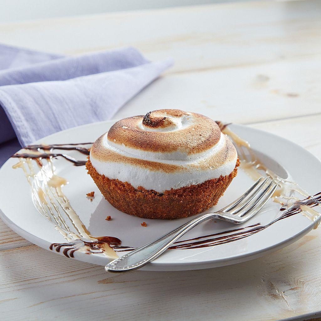 Individual S'mores pie with toasted marshmallow on a plate.