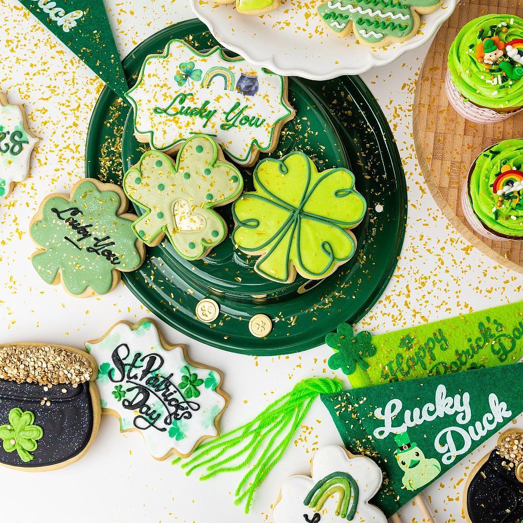 Assorted St. Patrick's Day cookies with green icing and shamrocks.