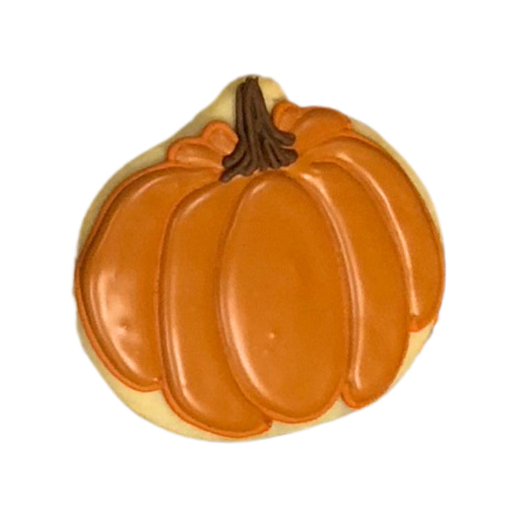 Thanksgiving pumpkin-shaped sugar cookie with orange icing.