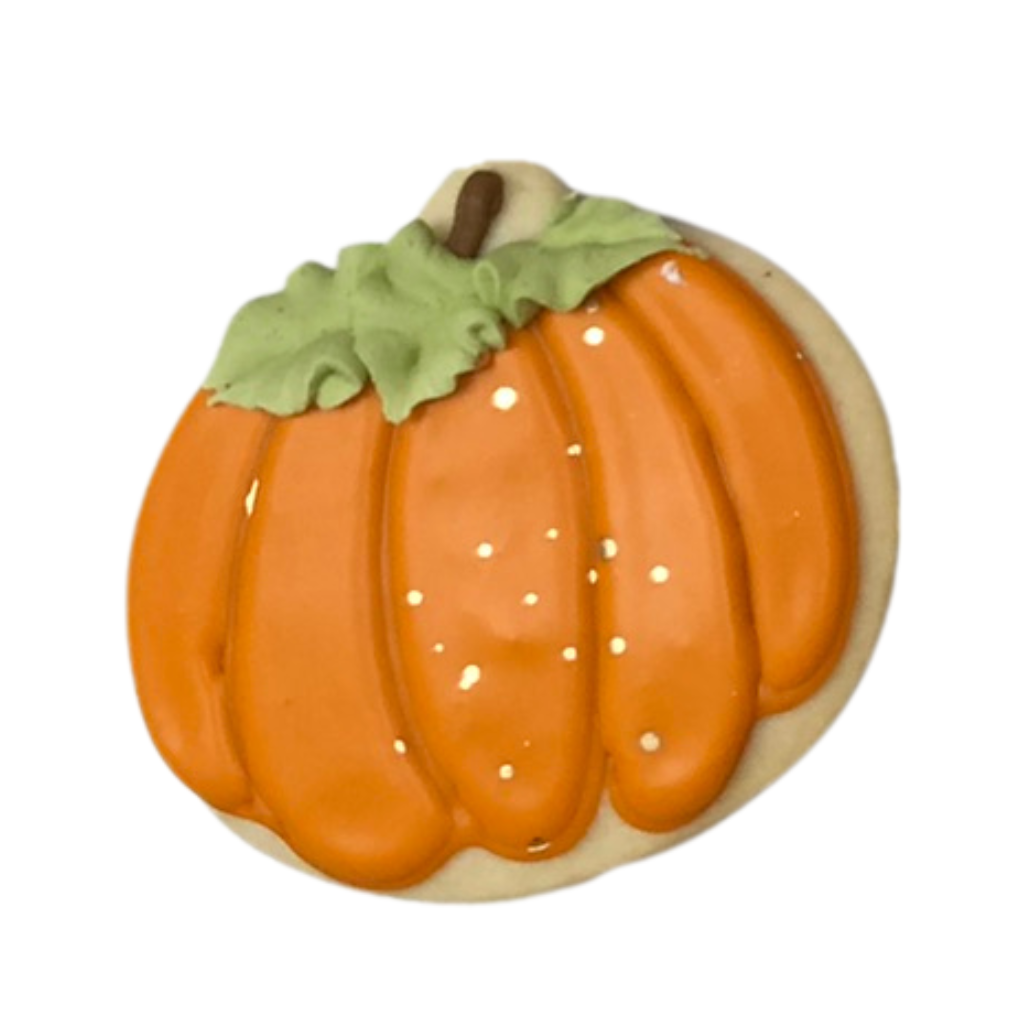 Thanksgiving pumpkin cookie with orange icing and green leaf.