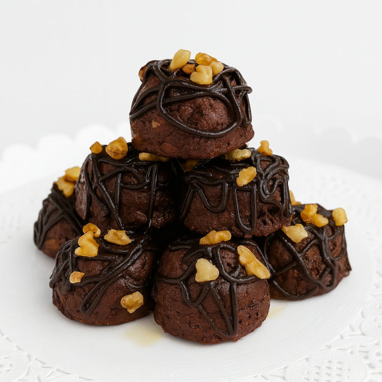 Feel-Good Fudge Brownie Balls drizzled with chocolate and walnuts