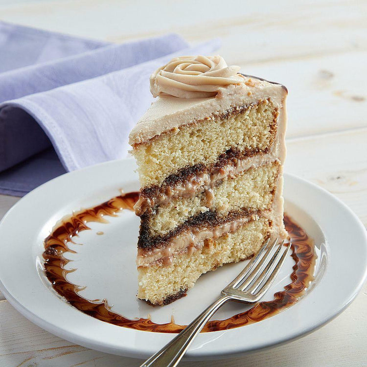 Slice of 9-inch Toffee-Licious cake with frosting swirl.