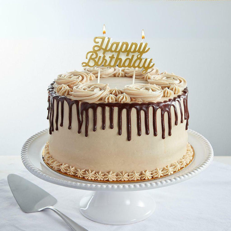 9-inch Toffee-Licious cake with chocolate drip and topper.