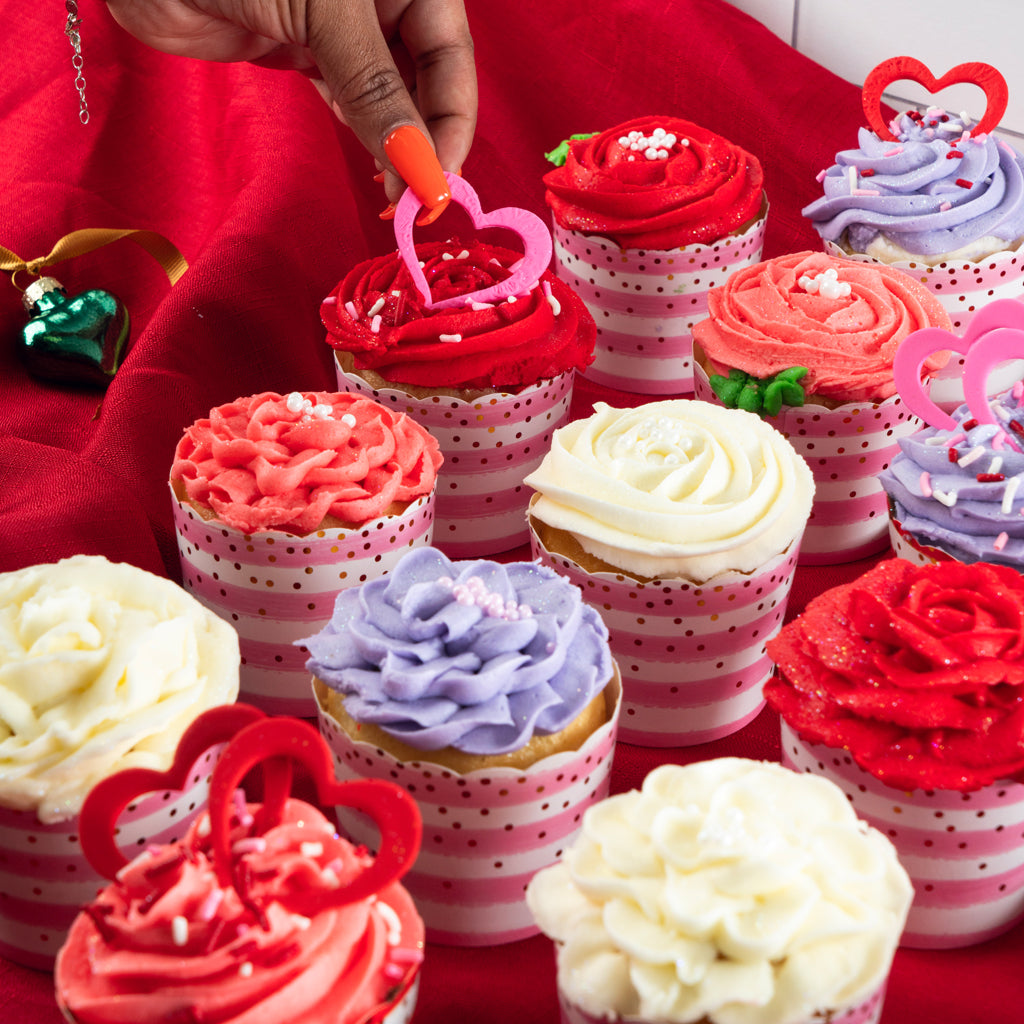 Valentine cupcakes with rose-swirl frosting in polka-dot liners