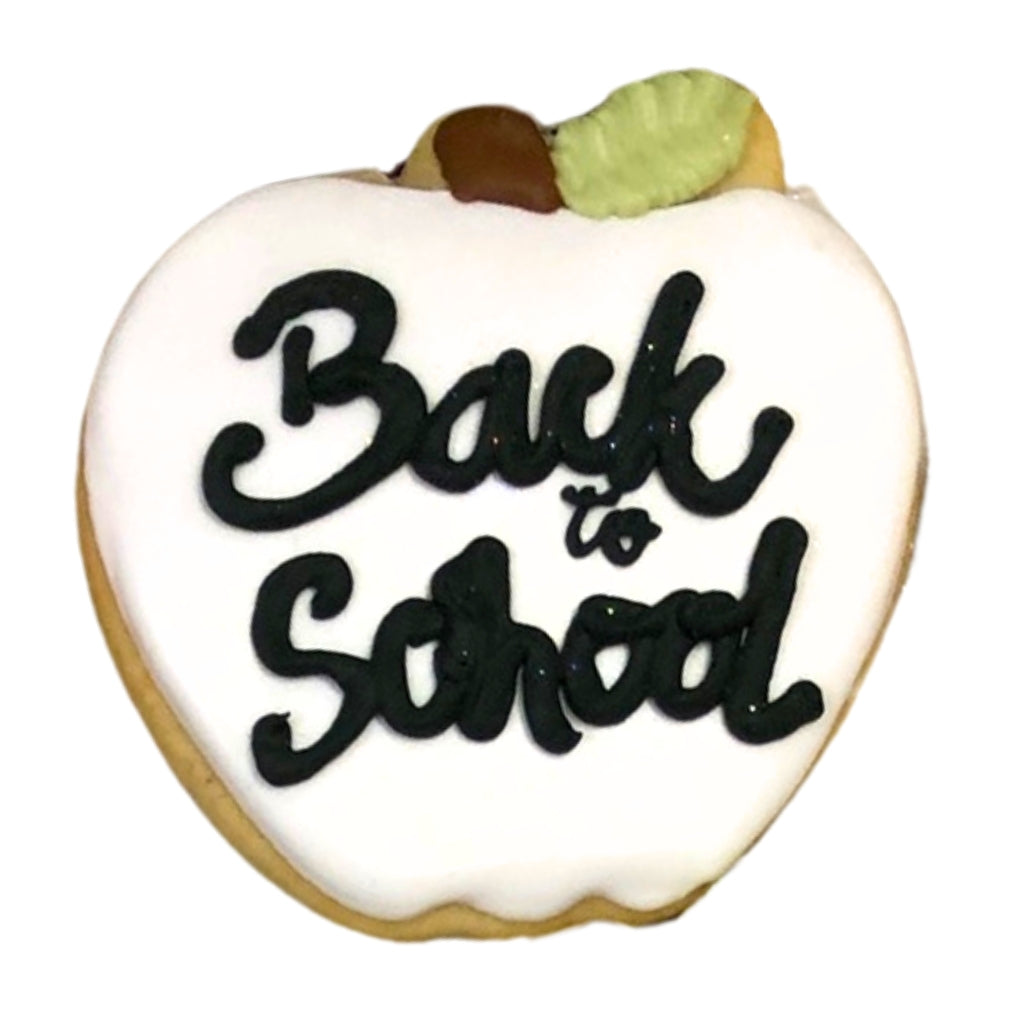 Apple-shaped Back To School cookie with white icing.