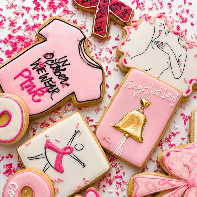 Assorted Breast Cancer Awareness cookies with pink icing.