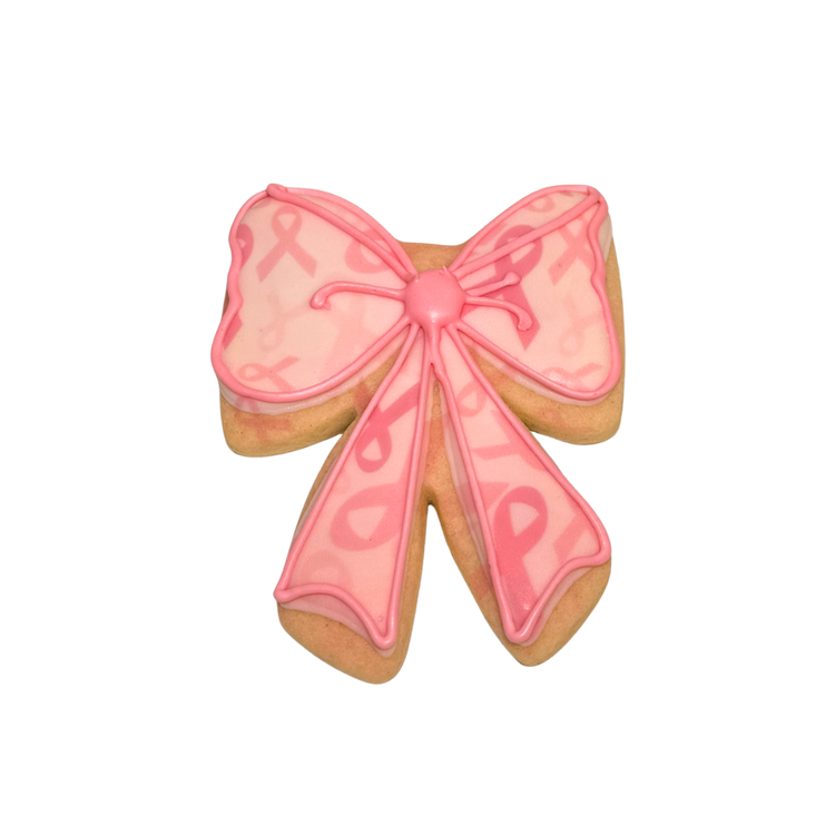 Breast Cancer Awareness bow-shaped cookie with pink icing.